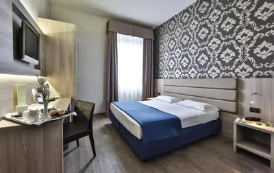 Letto o letti in una camera di Hotel San Marco & Formula Club