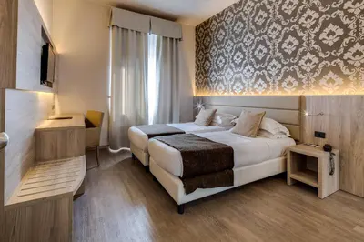 Letto o letti in una camera di Hotel San Marco & Formula Club
