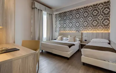 Letto o letti in una camera di Hotel San Marco & Formula Club