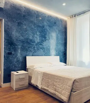 Letto o letti in una camera di Rooms Don Alfonso