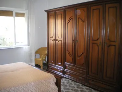 Letto o letti in una camera di Poppy