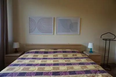 Letto o letti in una camera di Appartamento con Giardino