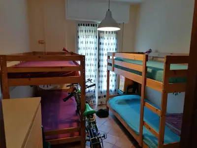 Letto o letti in una camera di Appartamento con Giardino