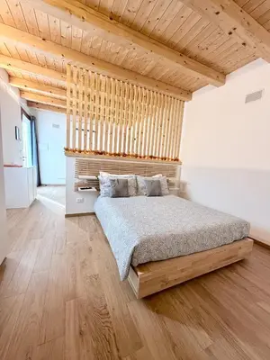 Letto o letti in una camera di MARCO APARTMENTS di Locanda da Marco