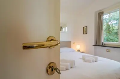 Letto o letti in una camera di CASA CAMILLA Relax con una vista da sogno