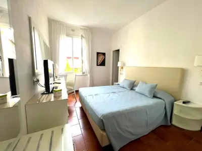 Letto o letti in una camera di Hotel Clelia