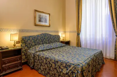 Letto o letti in una camera di Hotel Posta