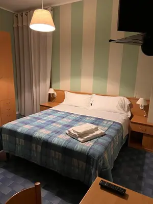 Letto o letti in una camera di Hotel Meri 1956 Locanda e Cucina