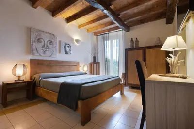 Letto o letti in una camera di Hotel Al Convento
