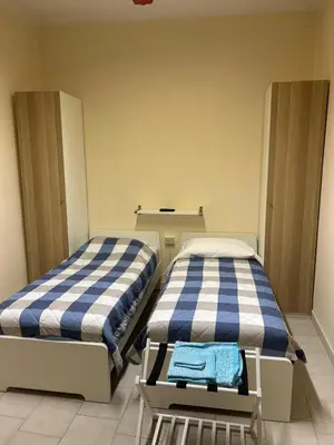 Letto o letti in una camera di Casa Timoteo