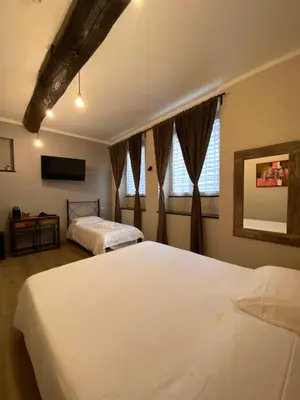 Letto o letti in una camera di Piccolo Borgo