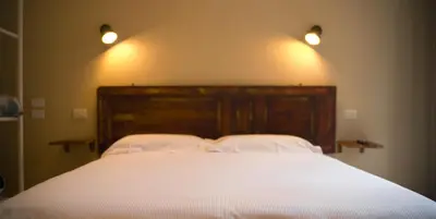 Letto o letti in una camera di Piccolo Borgo