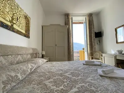 Letto o letti in una camera di Villa Margherita