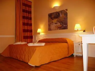 Letto o letti in una camera di Casa Romagnosi