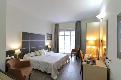 Letto o letti in una camera di Hotel Ferrari
