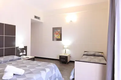 Letto o letti in una camera di Hotel Ferrari