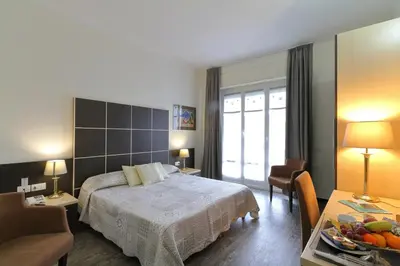 Letto o letti in una camera di Hotel Ferrari