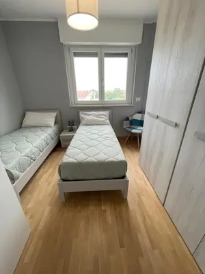 Letto o letti in una camera di Appartamento Iris