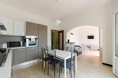 Cucina o angolo cottura di JOIVY Family Flat with 3 Balconies, 10 Min to Beach