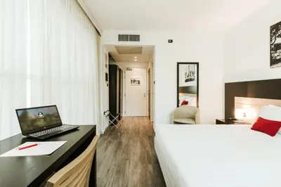 Letto o letti in una camera di Hotel Carpi