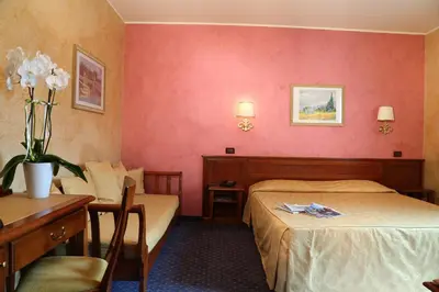 Letto o letti in una camera di Hotel Abacus