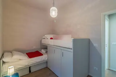 Letto o letti in una camera di CASA BRIGITTE Comfort, Vista e Parcheggio