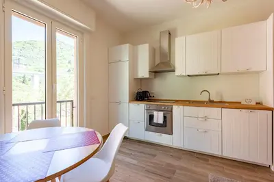 Cucina o angolo cottura di JOIVY Lele Apartment with Swimming Pool