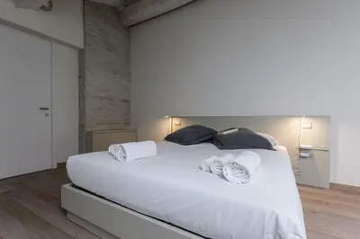 Letto o letti in una camera di Smeraldo Suite - Smart Holiday