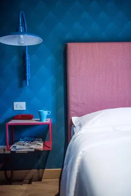 Letto o letti in una camera di Hotel Torino