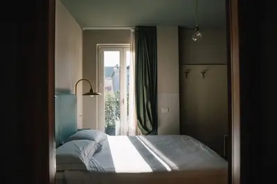Letto o letti in una camera di Hotel Torino