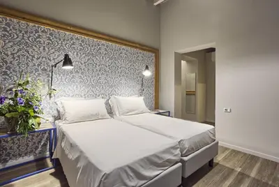 Letto o letti in una camera di Hotel Torino
