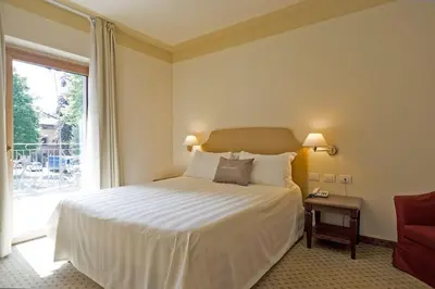 Letto o letti in una camera di Cora Hotels Leon d'Oro