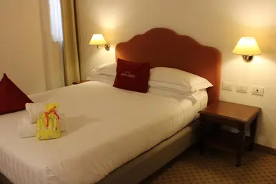 Letto o letti in una camera di Cora Hotels Leon d'Oro
