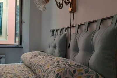 Letto o letti in una camera di Le ortensie di Villa Vittoria nel verde a pochi minuti di auto dalle spiagge