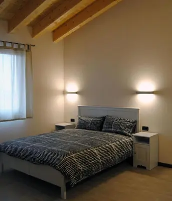 Letto o letti in una camera di Cascina Bosco Gerolo
