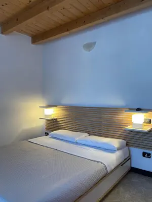 Letto o letti in una camera di Archi di sole - Appartamenti