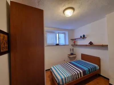 Letto o letti in una camera di CASA GAIA - Limoncello - parcheggio privato incluso