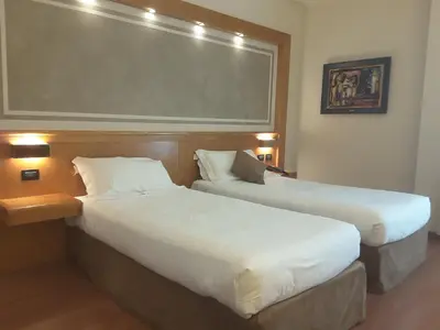 Letto o letti in una camera di Hotel President