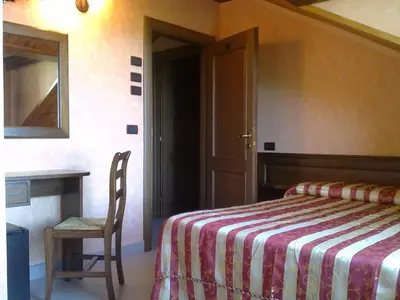 Letto o letti in una camera di Albergo Ristorante Belvedere
