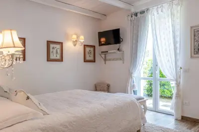 Letto o letti in una camera di Villa Valentina
