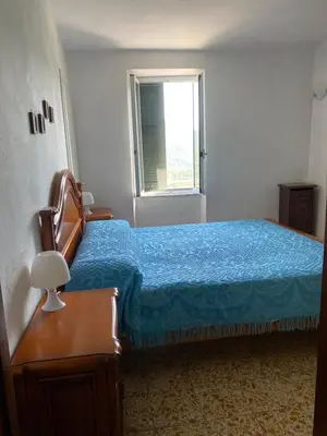 Letto o letti in una camera di Bilocale Mirella