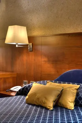 Letto o letti in una camera di Central Park Hotel Modena