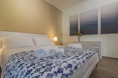 Letto o letti in una camera di CASA VERA Tra storia, mare e comodità