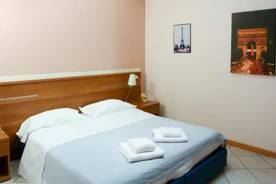 Letto o letti in una camera di Albergo Meublè Abatjour