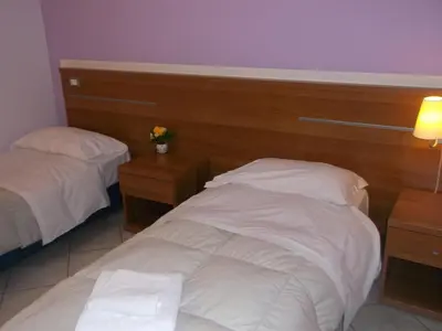 Letto o letti in una camera di Albergo Meublè Abatjour
