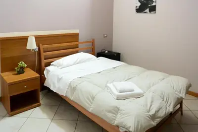 Letto o letti in una camera di Albergo Meublè Abatjour