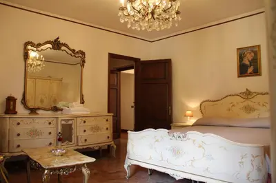 Letto o letti in una camera di Villa Veralda, la magia di una Toscana insolita