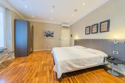 Letto o letti in una camera di Century Hotel