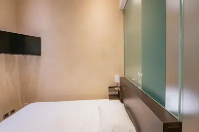 Letto o letti in una camera di Century Hotel