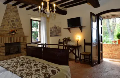 Letto o letti in una camera di Antico Borgo Di Tabiano Castello - Relais de Charme